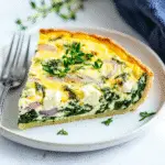 Delicious Crustless Spinach, Onion, and Feta Quiche Recipe Revealed 8 Slice of Crustless Spinach, Onion, and Feta Quiche on plate